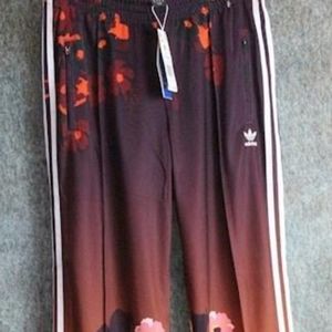 Adidas flowered sweat pants size Medium.